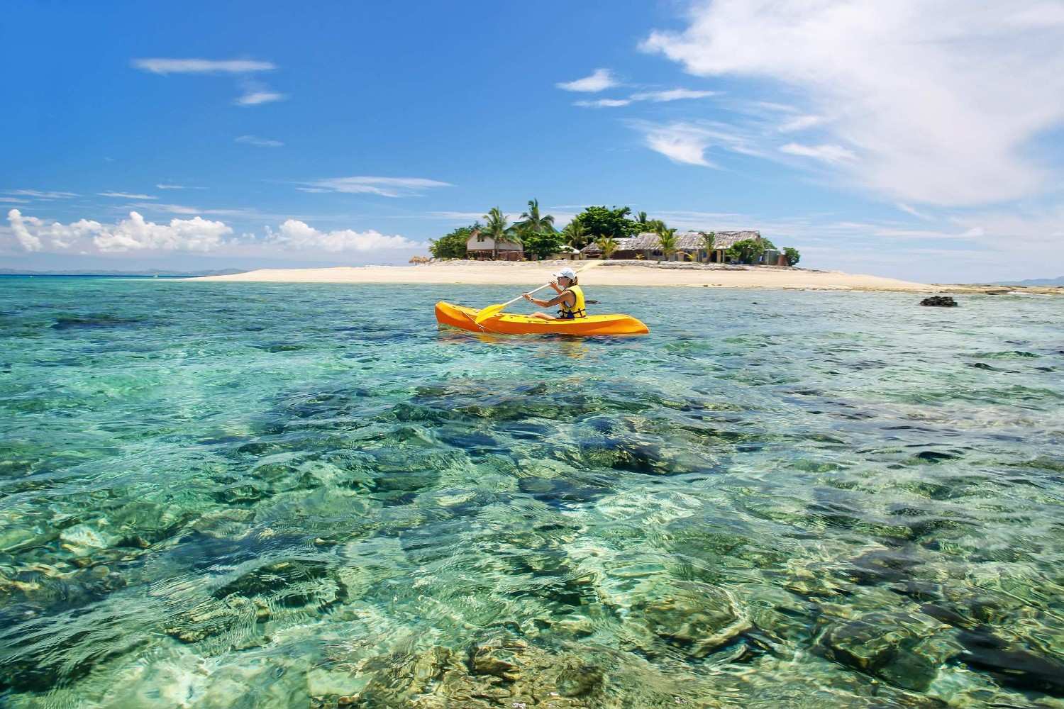 A Woman Kayaking Near South Sea Island Mamanuca Islands Group Fiji